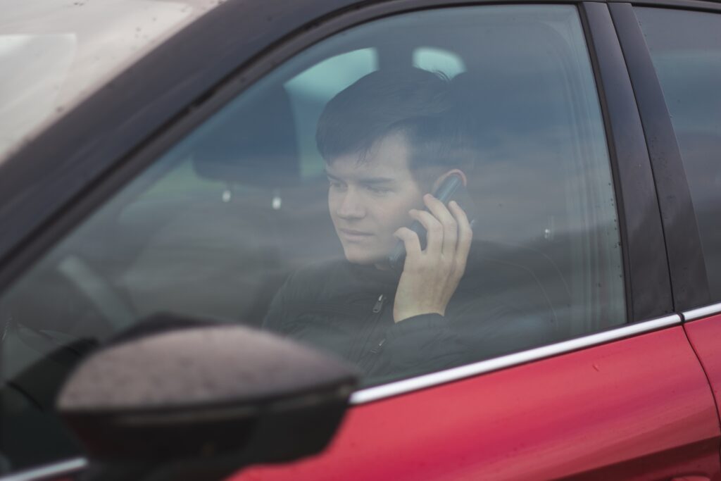 a man calling to the auto glass provider for mobile auto glass service