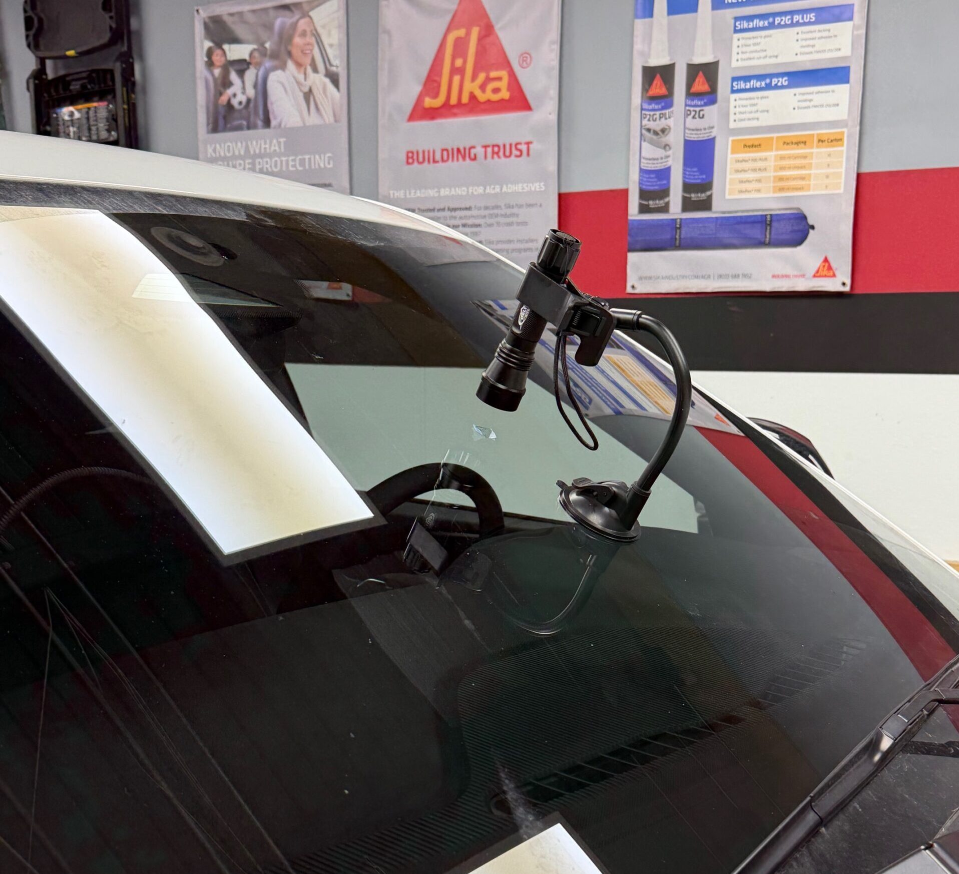 Windshield crack repair with flashlight inspection at save on auto glass